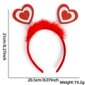 Detail view of red heart feather headband with 21cm height and 20.5cm width dimensions - Silver Border Heart Feather Style