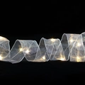 Macro detail of silver mesh LED ribbon with warm white lights and metallic edging - 1m / Silver (Warm Light)