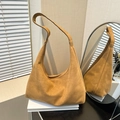 Minimalist brown suede tote bag in a premium setting with shadow and reflection details - Brown