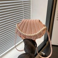 Pink shell-shaped crossbody bag with pearl handle and textured stripes for women - Pink