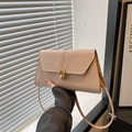 Minimalist beige faux leather crossbody bag with elegant gold buckle and shoulder strap - Khaki