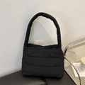 Chic black quilted padded shoulder bag with soft lightweight nylon finish and wide strap - Black