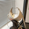 Champagne gold crescent hobo bag with metallic pleated texture and silver charm - Holographic Beige