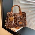 Stylish large leopard print tote bag with front pockets and plush bear charm accent - With Pendant / Brown