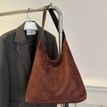 Minimalist dark brown suede tote bag with a spacious interior and soft slouchy design - Brown