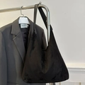 Minimalist black oversized velvet tote bag with wide strap and hobo style silhouette - Black
