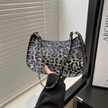 Chic hobo bag featuring grey leopard print with elegant golden metal buckles - Black Leopard