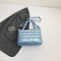 Light blue quilted puffer tote bag with metallic finish and adjustable shoulder strap - Blue