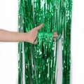 Vibrant green foil fringe curtain with metallic laser dots for festive party background - Green