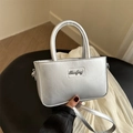 Elegant silver metallic mini square handbag with round handle and detachable shoulder strap - Silver