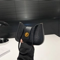 Chic black sequin crescent shoulder bag with a vintage gold circular twist lock - Black