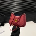 Chic red sequin crescent shoulder bag with leather trim and gold twist lock closure - Red