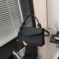 Minimalist black woven texture tote bag with knotted handle and detachable shoulder strap - Black