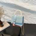 Mini light blue handbag with glitter finish and elegant white pearl top handle - Blue