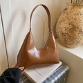 Vintage brown leather crescent hobo bag with a sleek glossy finish and shoulder strap - Brown