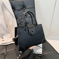 Structured black tote bag with faux crocodile leather trim and top handles - Black