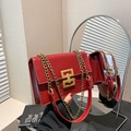 Chic red patent leather crossbody bag for women with gold chain strap and mirror detail - Red