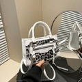 Women's chic leopard print crossbody bag with white leather trim and round top handle - White