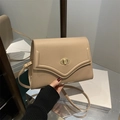 Chic beige crossbody bag with lychee texture leather and golden oval twist lock - Khaki