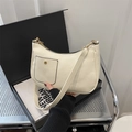 Minimalist cream white crescent shoulder bag with golden hardware and small front pocket - White
