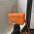Bright orange quilted crossbody bag with silver metal clasp and top handle for women - Orange