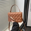 Brown quilted crossbody bag with golden bar detail and adjustable shoulder strap - Brown