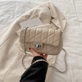 Minimalist cream quilted crossbody bag with silver chain and metal turn-lock closure - Khaki