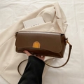 Minimalist dark brown polished leather crossbody bag with elegant gold metal clasp - Brown