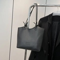 Minimalist black faux leather tote bag with vintage fashion embossing and knotted straps - Black