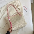 Stroh-Shopper in Cremeweiß mit rosa Lederbesatz und dekorativem Quasten-Anhänger - Rosa
