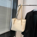 Creamy white oversized faux leather tote bag with contrasting light brown shoulder strap - Off White