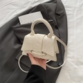 Chic cream white pleated glossy crossbody bag with round top handle and flap closure - White