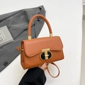Brown leather handbag with gold T-shaped clasp and adjustable strap for women - Brown