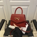 Red bow fashion crossbody handbag in premium PU leather with golden metal clasp - Red