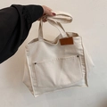 Bolso tote minimalista de lona blanco roto con bolsillo exterior y remaches metálicos - Blanco