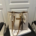 Beige woven straw tote bag with brown leather handles and golden ring accents - With Pendant / Brown