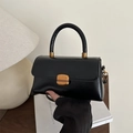 Chic black crossbody handbag with glossy leather finish and vintage gold square buckle - Black