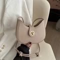Minimalist apricot half-moon hobo bag with gold metal clasp and knotted strap detail - Khaki