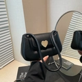 Minimalist black faux leather shoulder bag featuring a vintage gold heart-shaped metal buckle - Black