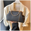 Detail of dark grey woven texture bag with vintage gold hardware and chain strap - Black