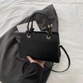 Minimalist black tote bag with knot handles and Fashion Trend print in matte leather - Black