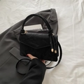 Minimalist black square handbag with knotted handle and gold metal detailing - Large / Black