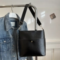 Classic black faux leather tote bag with wide strap and metallic bead detail on pocket - Black