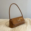 Retro brown underarm bag in glossy PU leather featuring a silver bow metal buckle - Brown