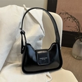 Minimalist black faux leather underarm bag with silver buckle and embossed fashion text - Black