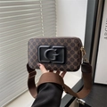 Deep brown crossbody bag with vintage monogram and large G logo on wide canvas strap - Black