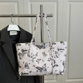 Borsa tote alla moda beige con stampe di farfalle nere e motivi celestiali - Nero