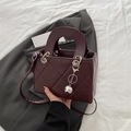 Quilted burgundy square handbag with silver sphere charm and elegant leather strap - Brown