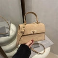 Minimalist beige crossbody bag with pleated leather texture and gold metal twist lock - Khaki