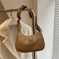 Brown woven hobo bag with a silver butterfly clasp and gathered shoulder strap detail - Khaki